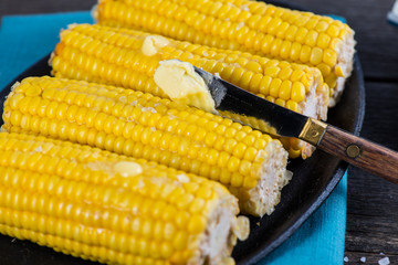 hot golden corn cob with butter and salt
