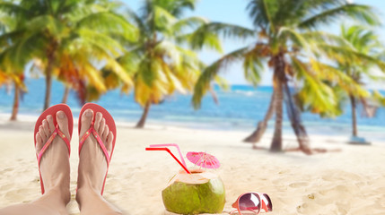 Red flip flops on sandy beach