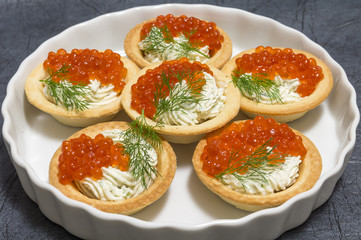 Tartlets with red caviar and cream cheese