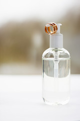 Plastic bottle with a lubricant and two wedding rings