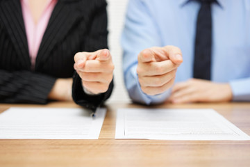 businessman and businesswoman pointing with fingers to you. Staf