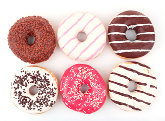 Delicious donuts with icing isolated on white