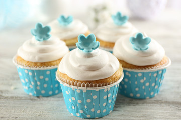 Delicious cupcakes on table close-up