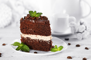 Delicious chocolate cake on table on light background
