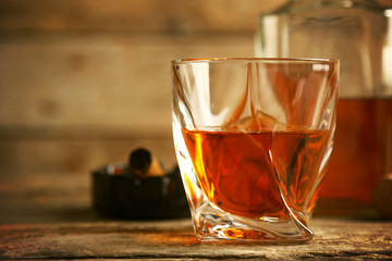 Whiskey on wooden background