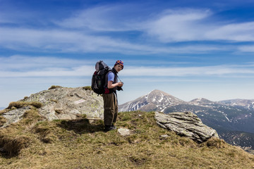 Young tourist on a background of mountains