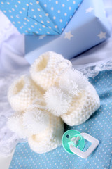 White baby boots on cloth close-up
