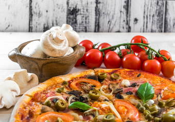 Pizza with ham and olives