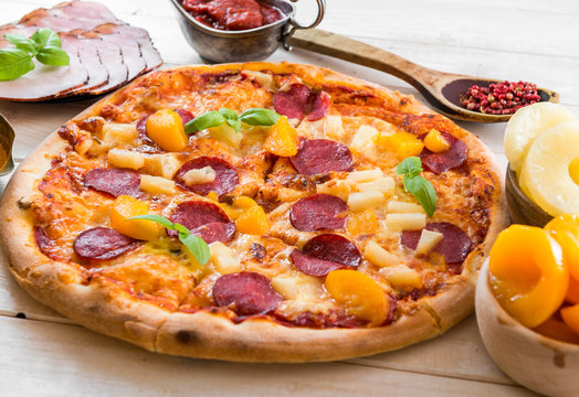 exotic pizza with pineapple and peach
