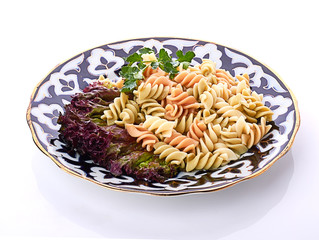 Penne pasta with sauce, cheese and basil, selective focus