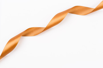 golden satin ribbon twisted in a spiral