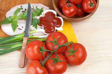 Raw chicken breasts on cutting board