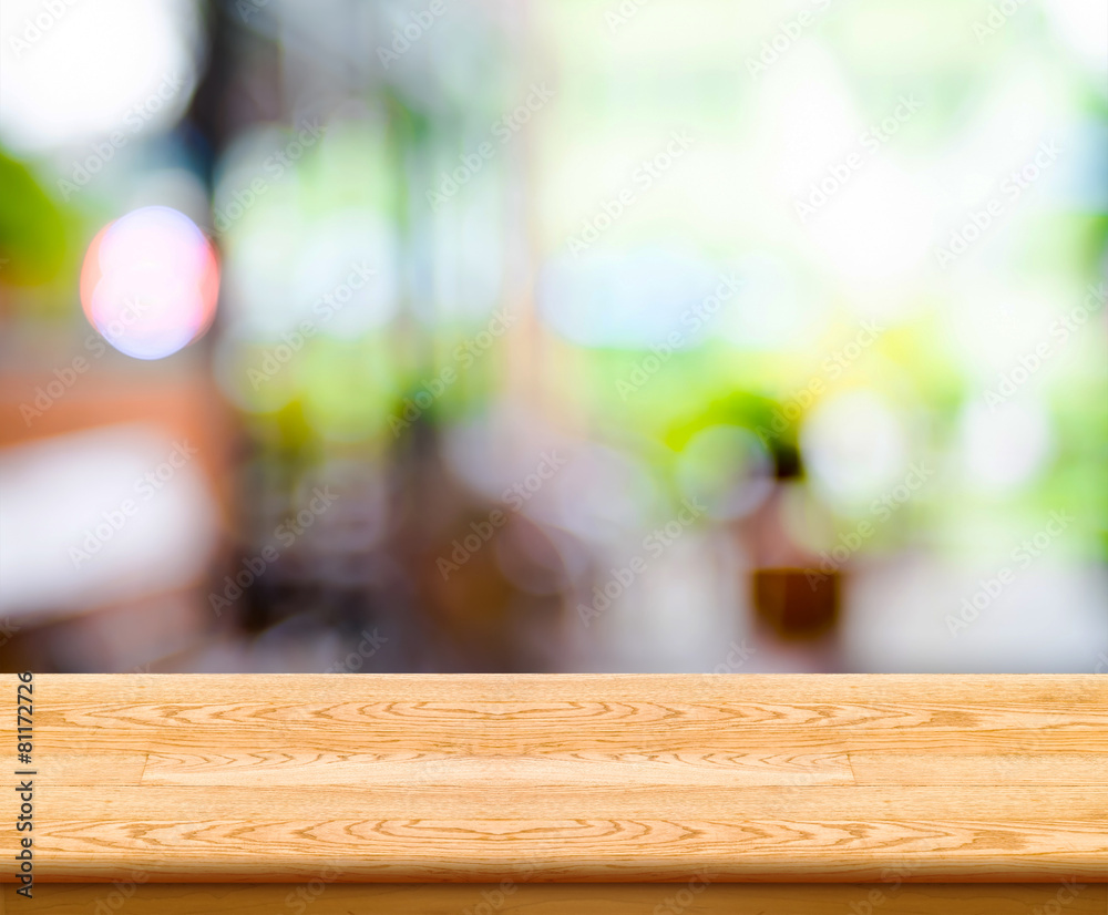 Poster empty wood table top with coffee shop blur with bokeh background