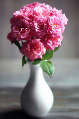 Bouquet of beautiful fresh roses on blurred background