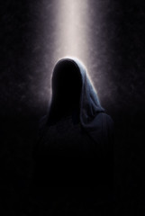 Cloaked Figure in Spotlight