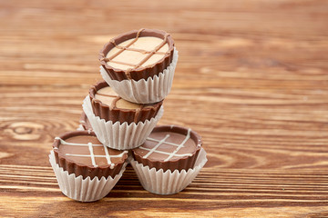 Dark chocolate on wooden background