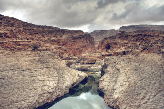Wadi Bani Khalid Running Through Rocky Canyon