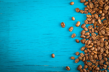 coffee beans on blue wooden board