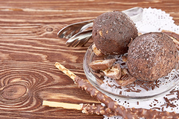 Cupcake with chocolate on wooden background