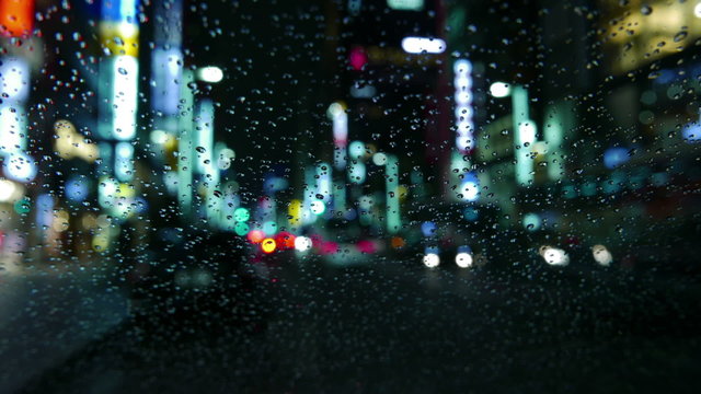 Nightlapse of out of focus illumination in rain.