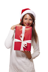 Pretty woman in a Santa hat with a large gift