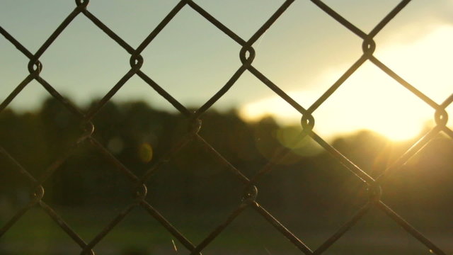 Sunset Through Fence