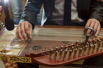 Male Hands Playing Arabian Qanun Musical Instrument