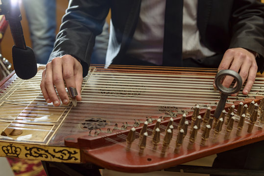 Male Hands Playing Arabian Qanun Musical Instrument