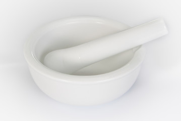 White mortar and pestle on a white background