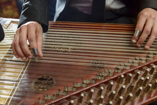 Fingers Playing Arabian Qanun Musical Instrument