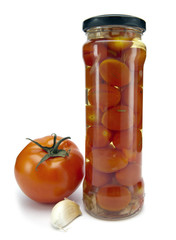 canned tomatoes in glass jars