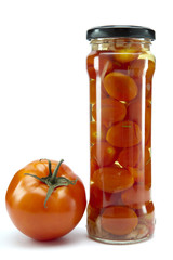 canned tomatoes in glass jars