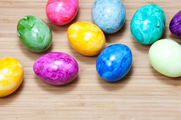 Obraz na płótnie Canvas Easter egg, wooden table, colorful