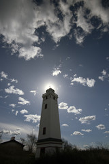 Sunny sky blue lighthouse