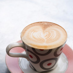 a cup of coffee on table