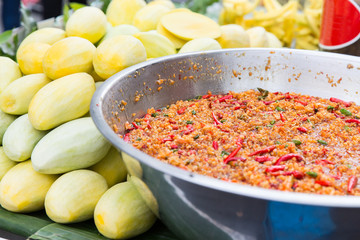 chilly wok or pilaf and mango at street market