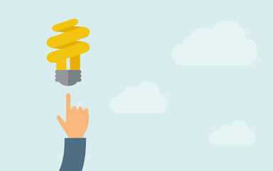 Hand pointing to spiral bulb