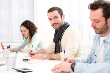 Obraz premium Young attractive student during classes