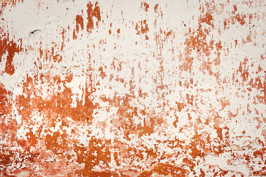 Old empty wall background, plaster falling off.