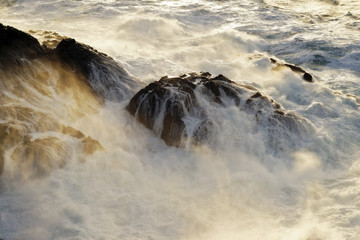 giant waves breaking on the cliffs