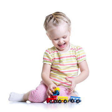 child girl playing with color toys