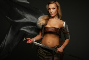 Fototapeta na wymiar Middle age female holding sword