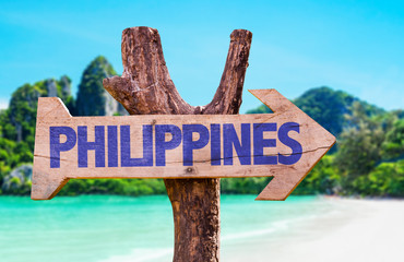Philippines wooden sign with beach background
