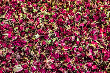 Obraz premium Background of dried petals of rose. Dry clover flower tea.