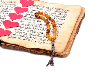 Manuscript Holy Quran and Muslim prayer beads