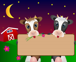 Two cows with wood board on night farm