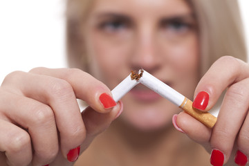 Close up Young Woman Breaking a Cigarette Stick
