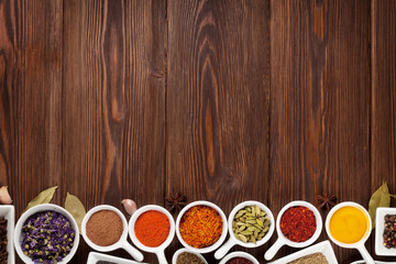Various spices on wooden background