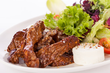grilled beef stripes fresh salad and goat cheese