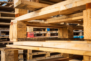 Wooden transport pallets in stacks. 